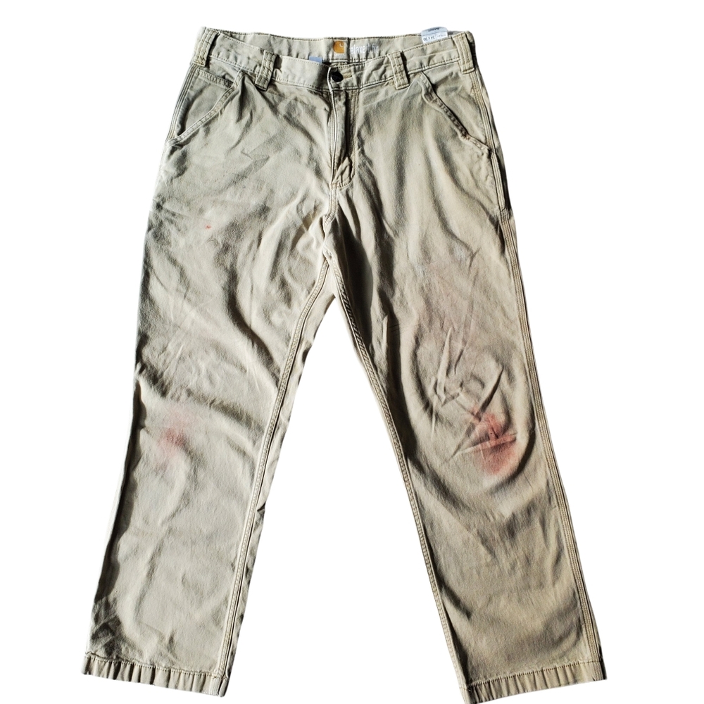 Vintage Carhartt carpenter pants in a worn-in workwear fade